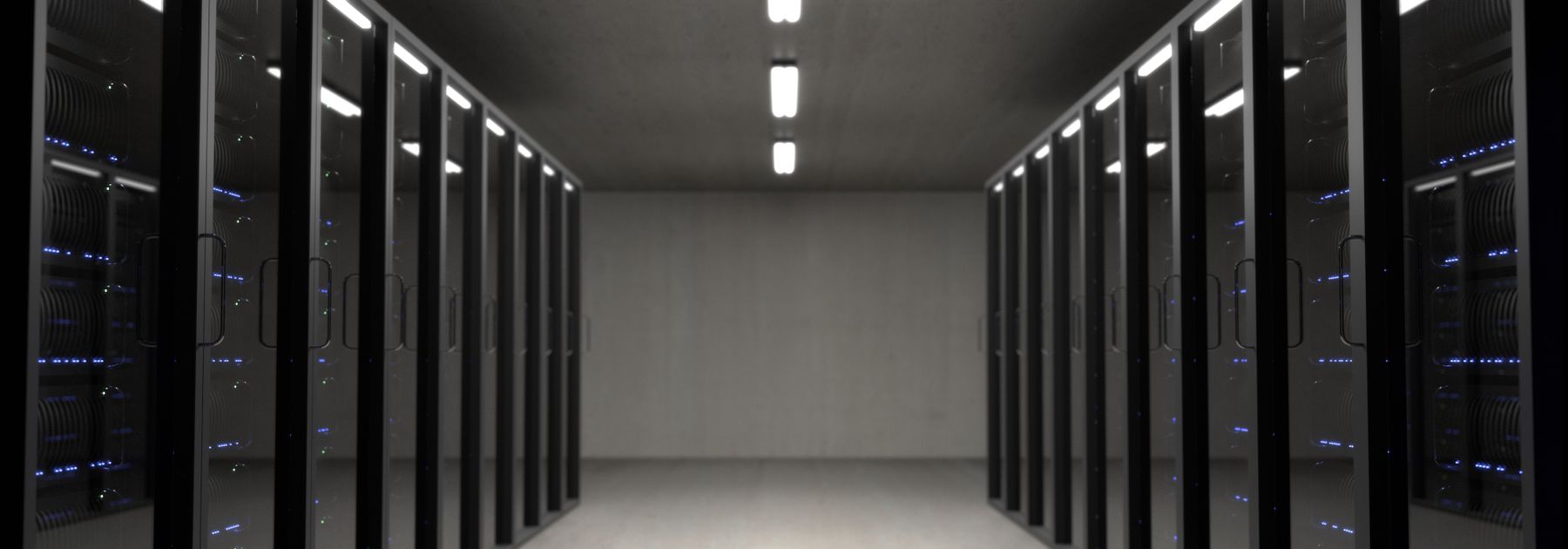 Server racks in a data centre, illustrating systems integration.